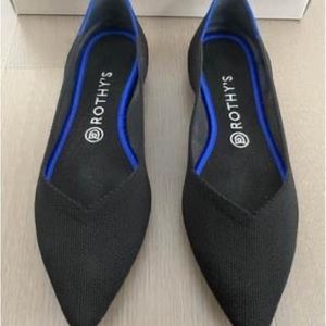 Black Rothy’s pointed flats. Only worn once
